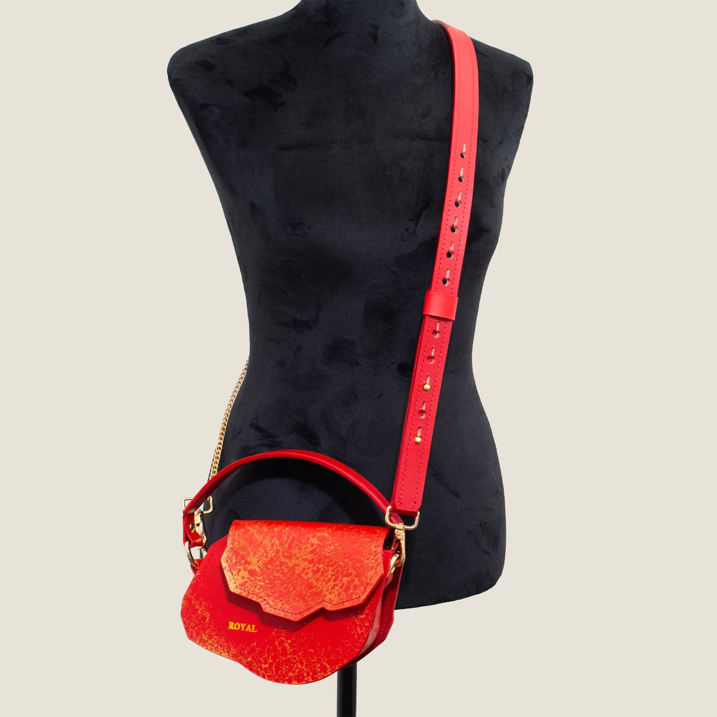Charity leather crossbody bag shown on mannequin. A structured mini silhouette with luxury chain strap.
