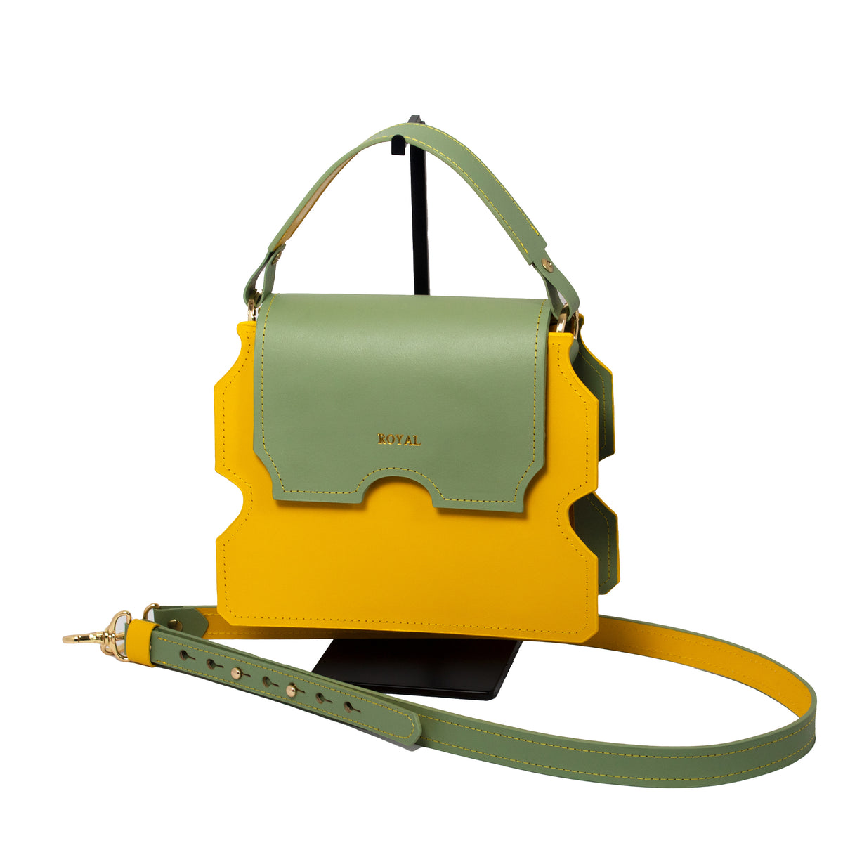Faith full‑grain vegetable‑tanned leather shoulder bag in yellow with a pastel mint green flap shown in a front view with its top handle and custom two‑tone strap