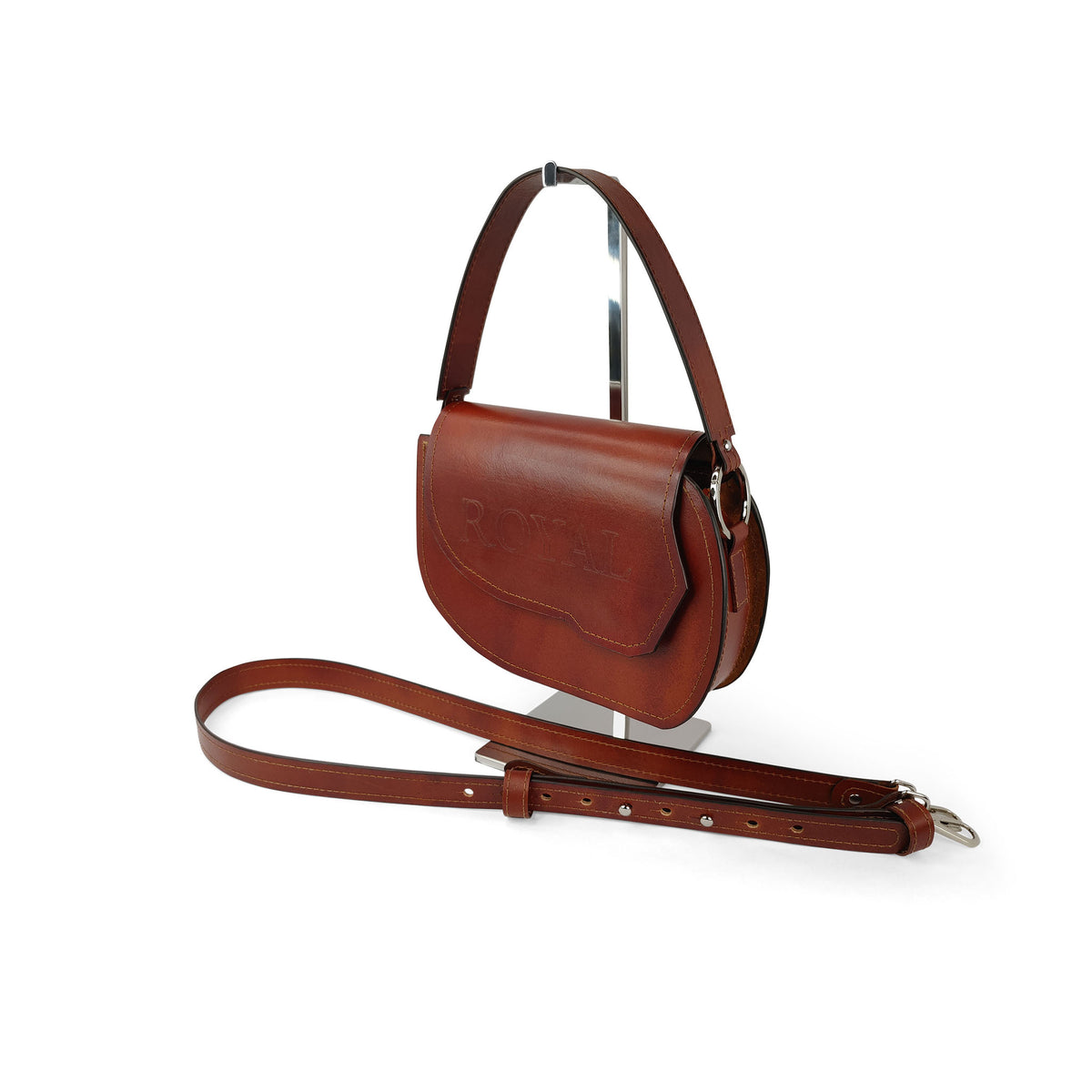 Grace full‑grain vegetable‑tanned leather top‑handle crossbody bag in brown shown in a side view highlighting the top handle and strap