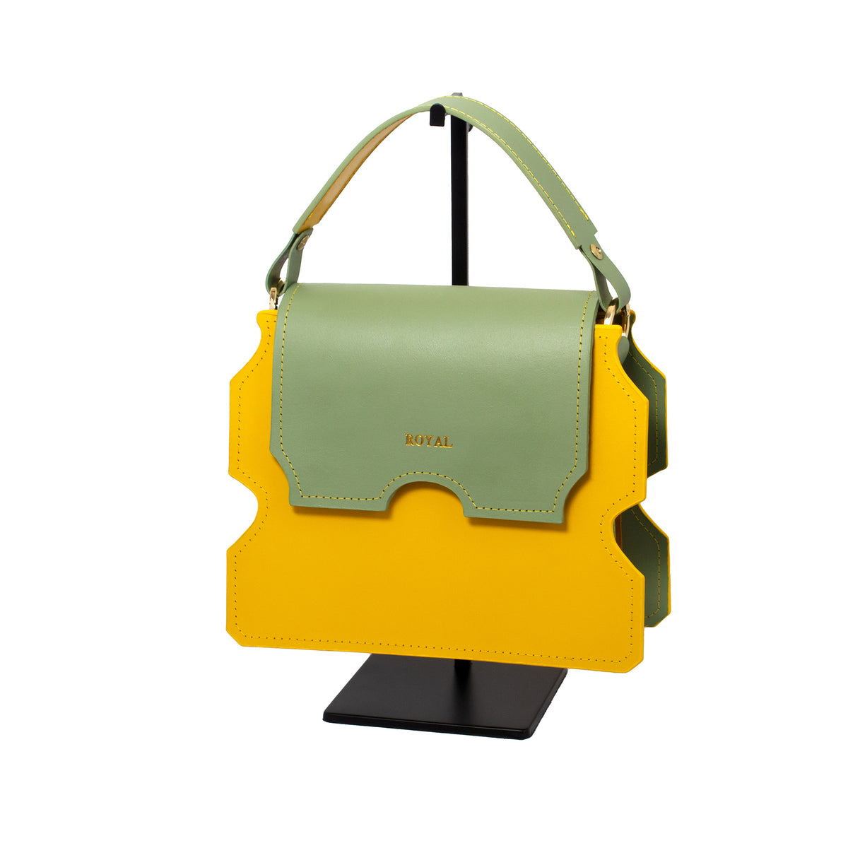Faith full‑grain vegetable‑tanned leather shoulder bag in yellow with a pastel mint green flap shown in a front view on a stand with its top handle