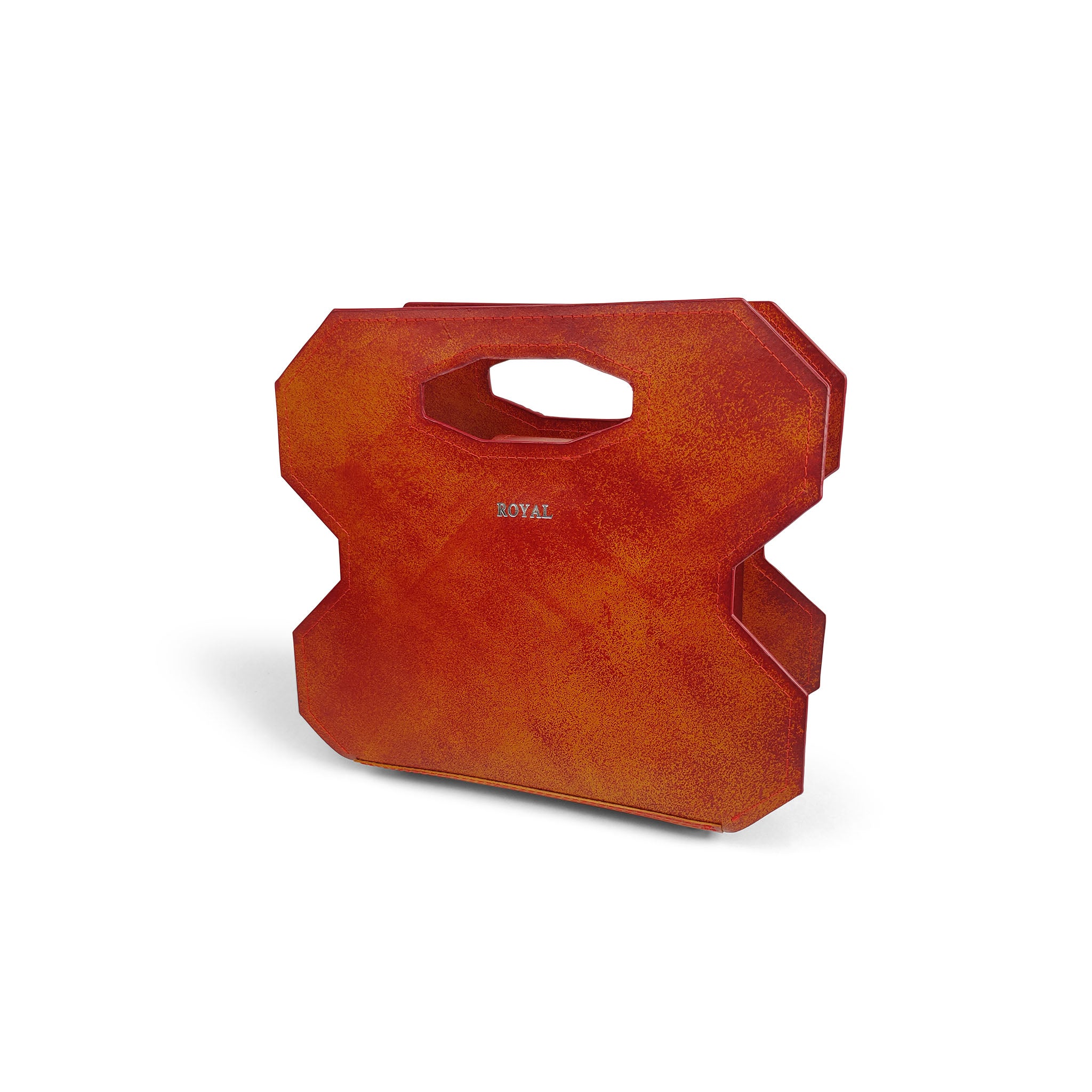 Luxury full‑grain leather handbag with bespoke cut‑out handle design and refined craftsmanship