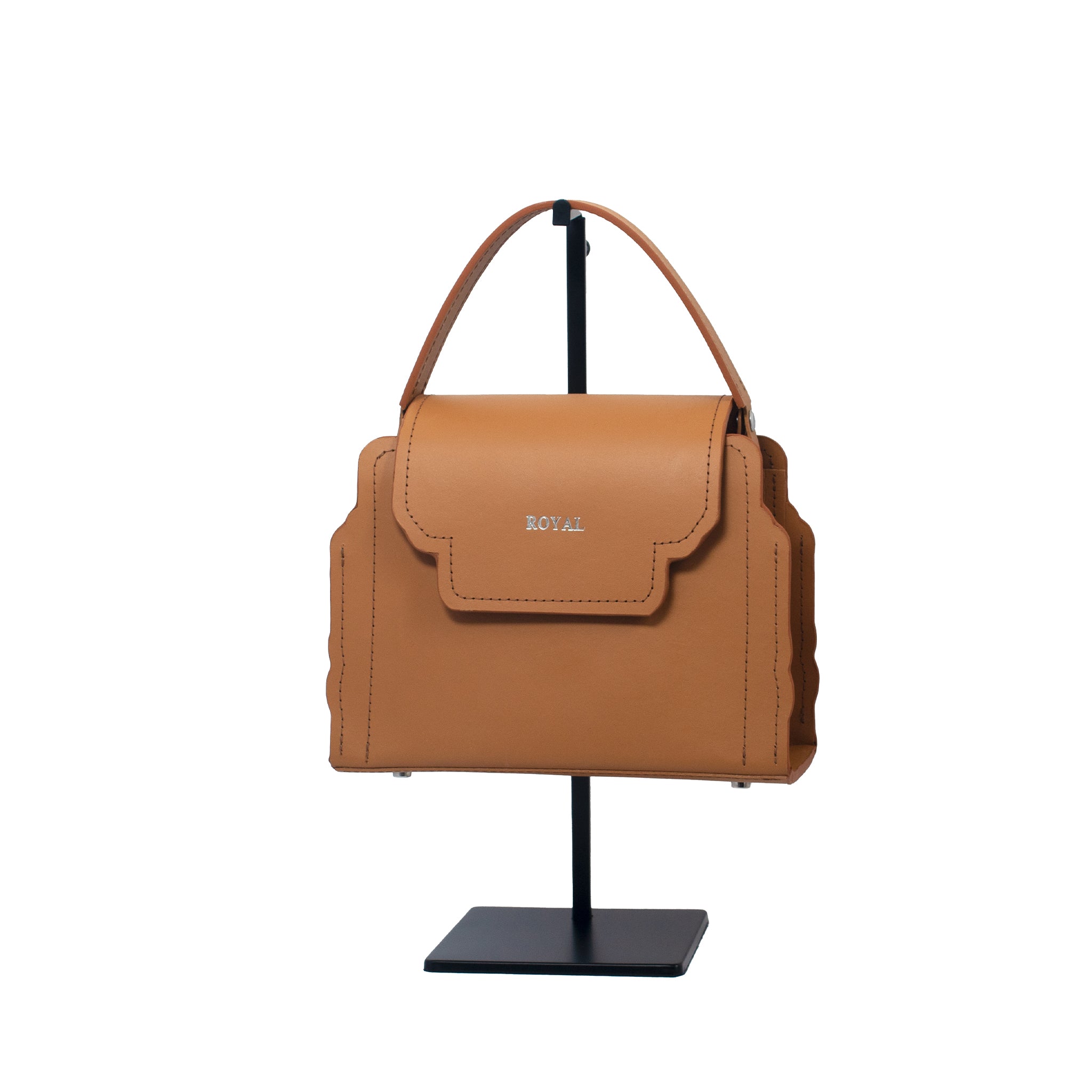 Customizable full grain leather shoulder bag, available in crossbody, satchel, or mini variations with versatile carry options